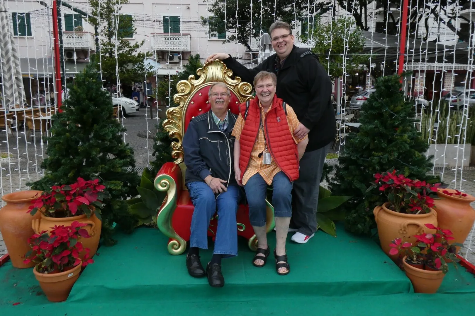 A photo with my parents in the Christmas village.