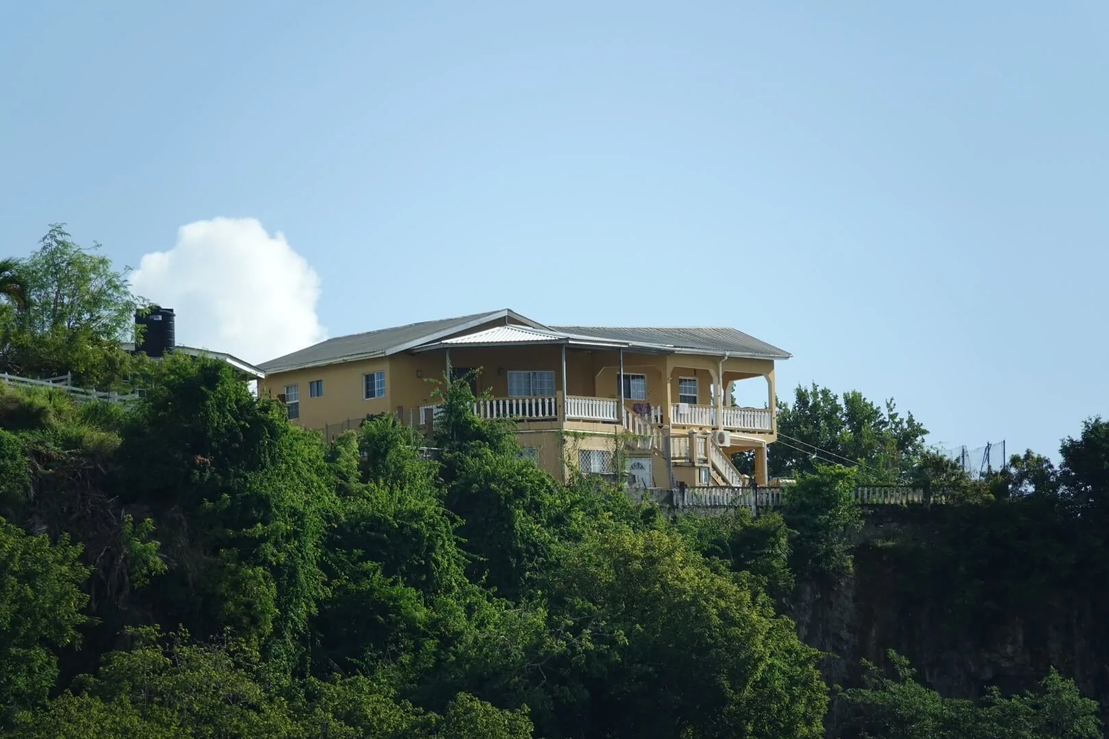 A view of a grand colonial-style villa in Kingstown.