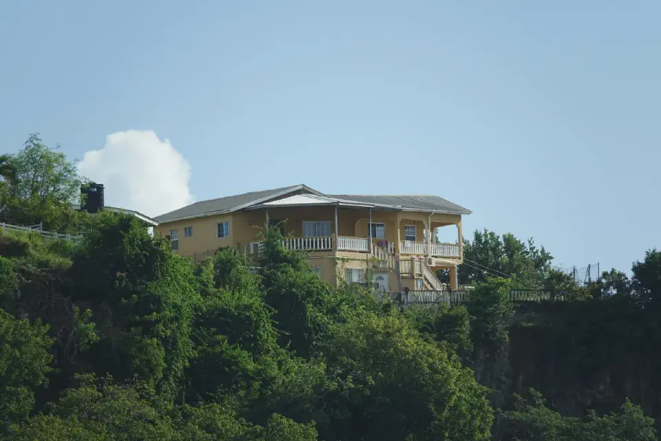 A view of a grand colonial-style villa in Kingstown.