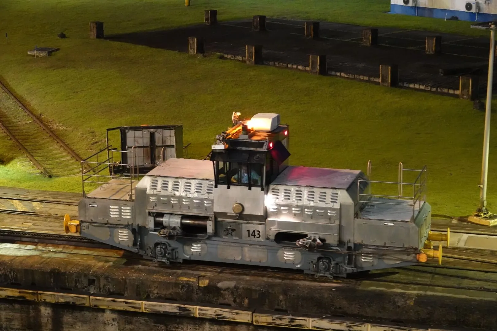 A view of one of the locomotives pulling the ship into the lock.