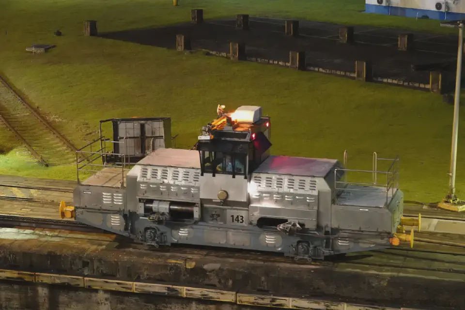 A view of one of the locomotives pulling the ship into the lock.