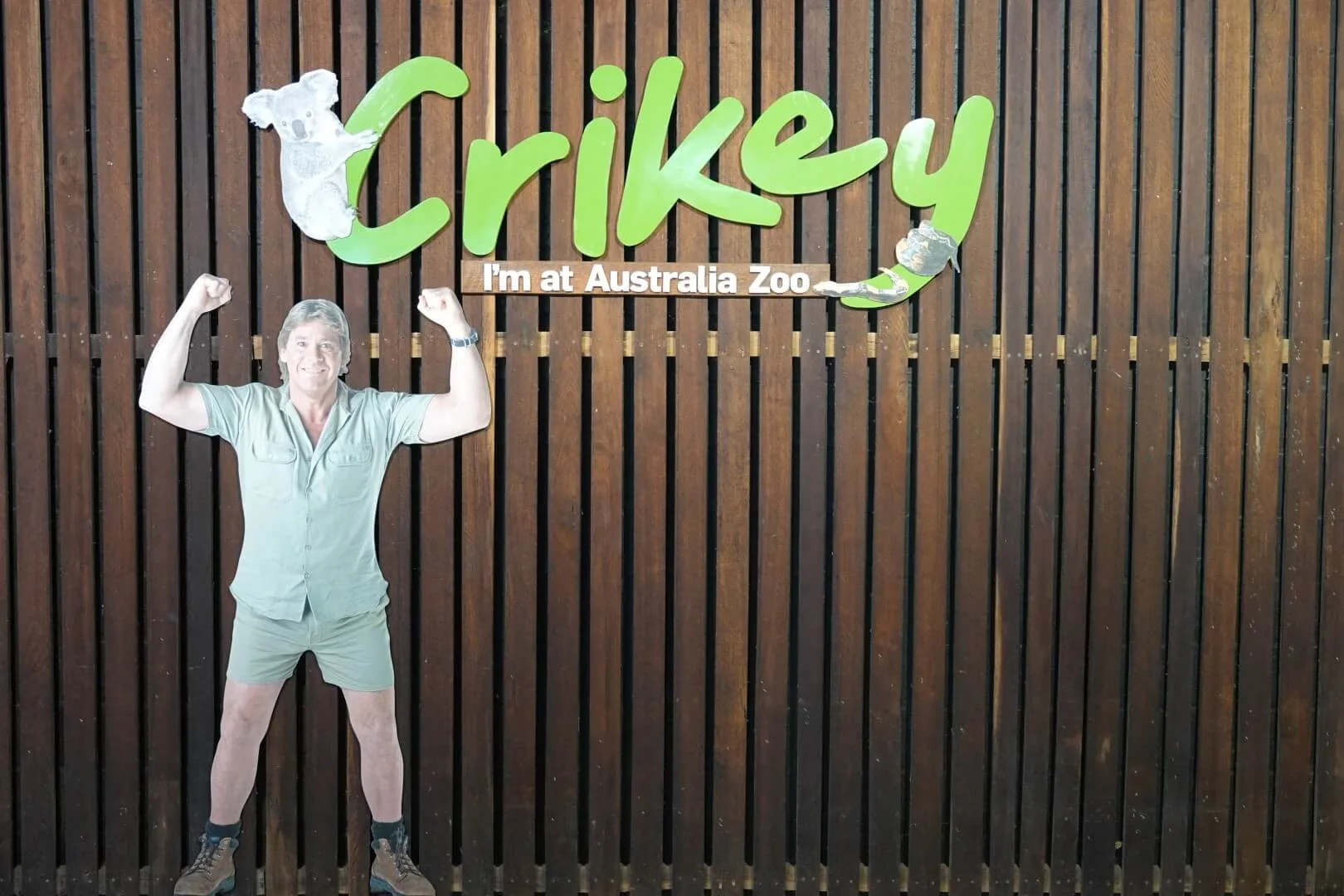 A photo wall with Steve Irwin welcomes visitors at the entrance.