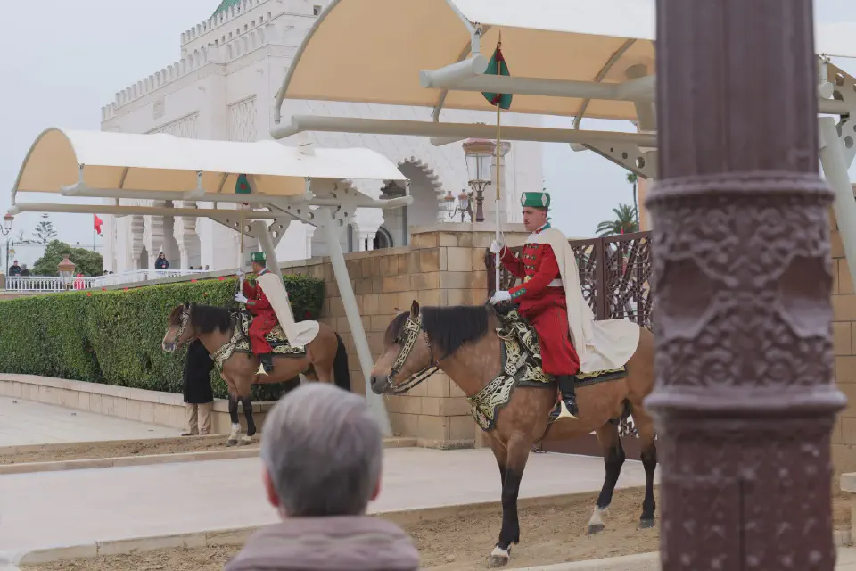 Mounted guards at the Mausoleum of Mohammed V - colorful uniforms and magnificently adorned horses.