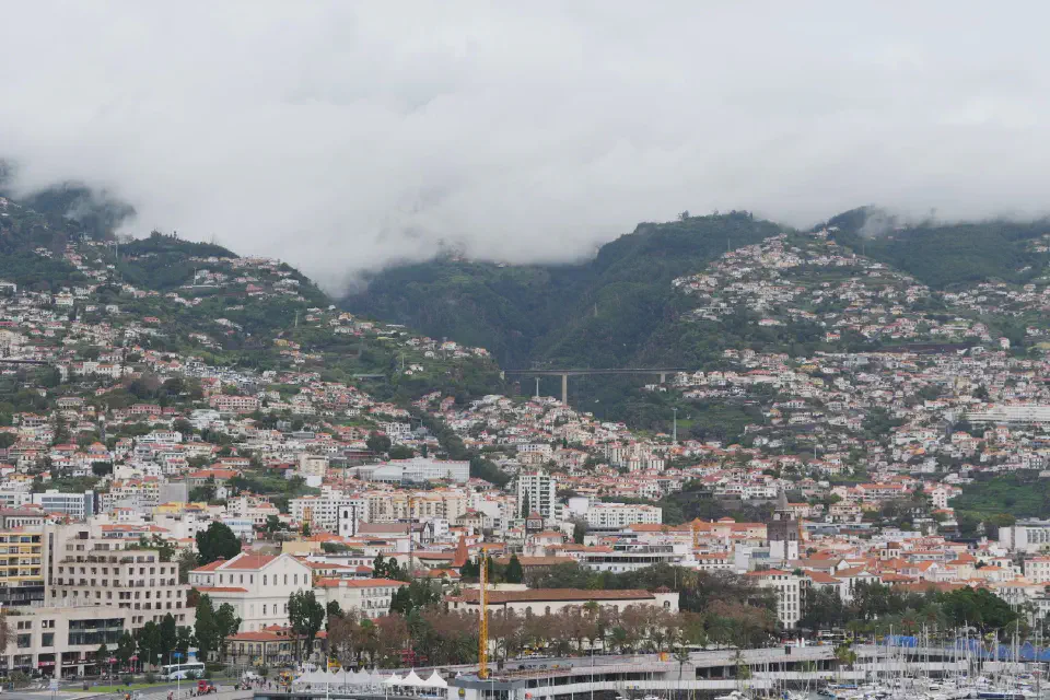 View of Funchal - Madeira’s capital nestled picturesquely against the slopes of the surrounding mountains.