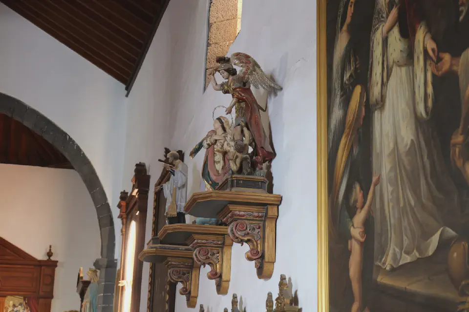 Detailed statues of saints inside the Church of San Ginés in Arrecife.
